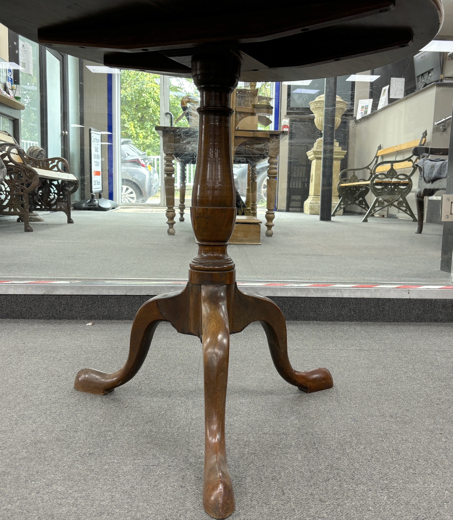 A George III circular mahogany tilt top tripod tea table, width 76cm, height 72cm